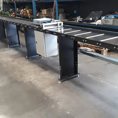 AS30A mounted on roller conveyor tables