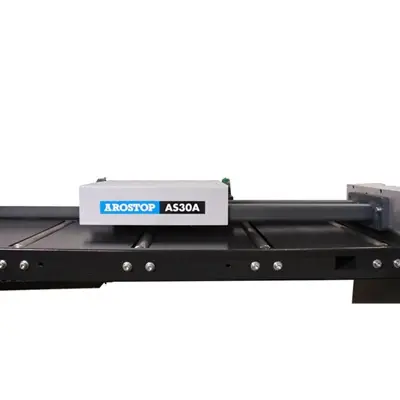 AS30A mounted on roller conveyor tables